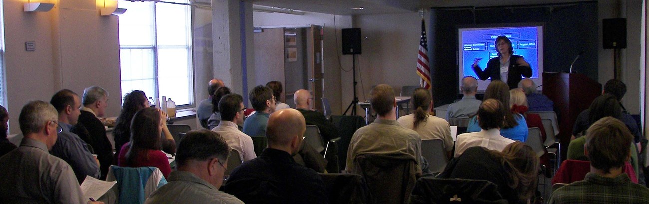 2011 Harbor Herons attendees listen intently to NYC Audubon Director, Susan Elbin present research results.