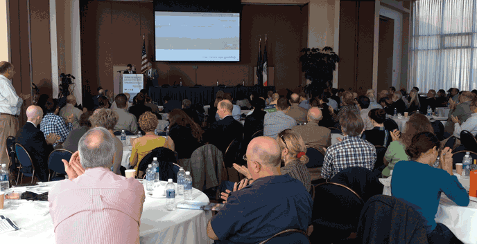 An audience of more than 300 applauds speakers as they present research and restoration efforts in Jamaica Bay and discuss the impacts of Hurricane Sandy on its ecosystem and watershed. More than 20 speakers presented on the first of the two day symposium. An audience of more than 300 applauds speakers as they present research and restoration efforts in Jamaica Bay and discuss the impacts of Hurricane Sandy on its ecosystem and watershed. More than 20 speakers presented on the first of the two day symposium.
