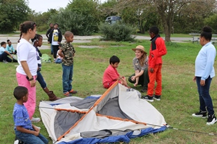 Ranger Kathryn teaching 4th graders how to put up a tent
