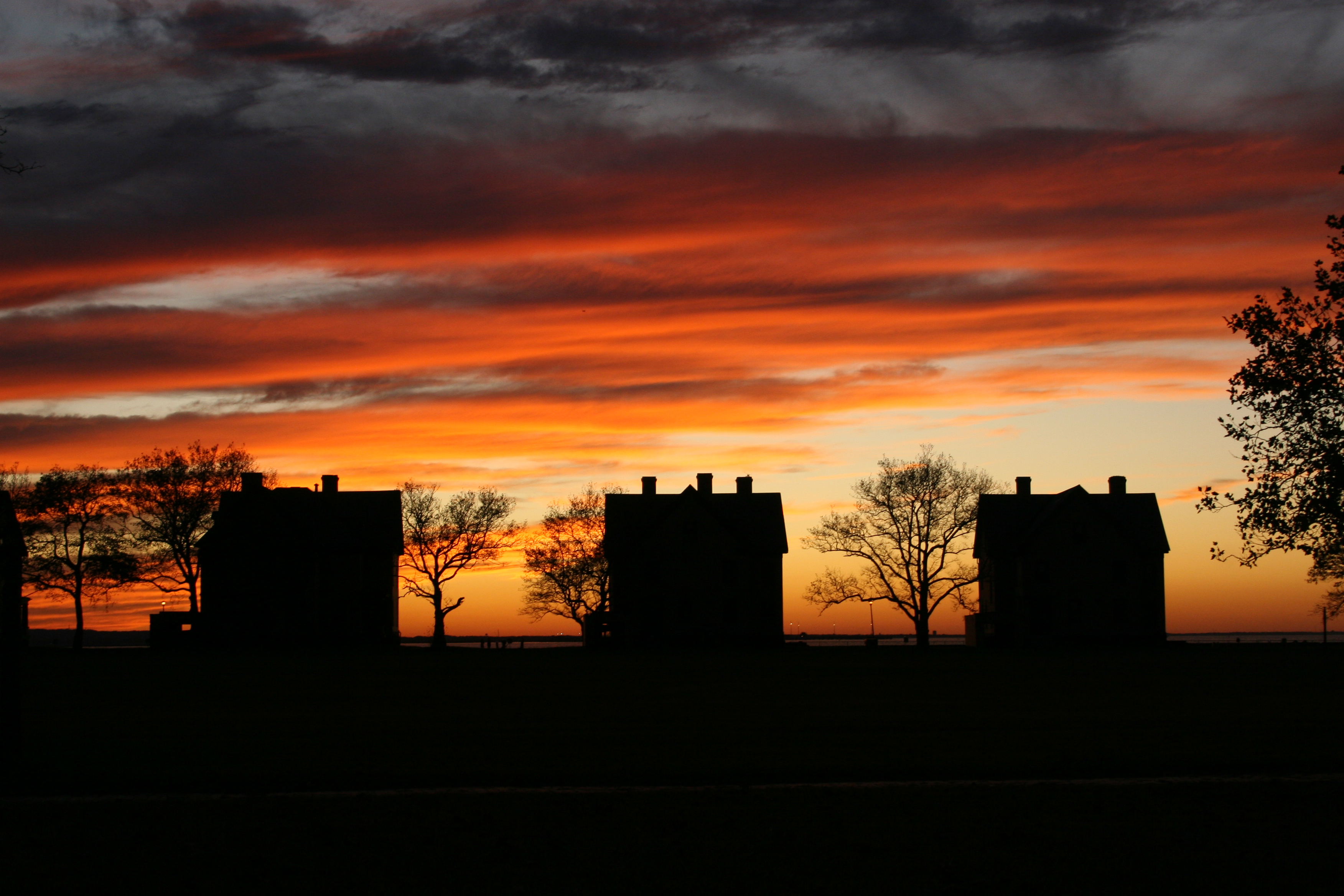 Silhouettes of houses at sunset