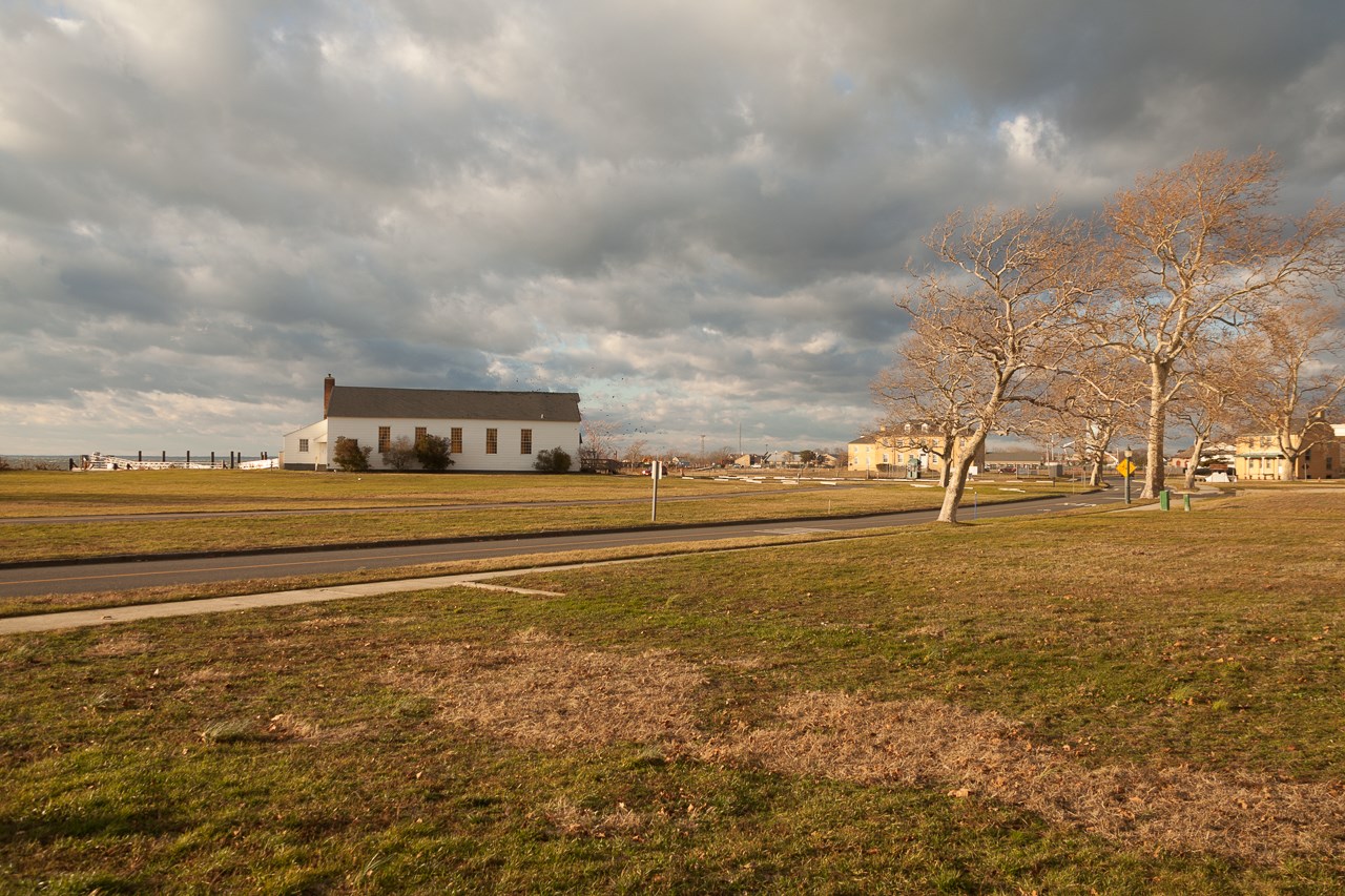 Historic chapel against cloudy sky