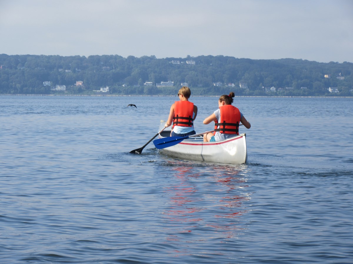 Two women canoeing in Sandy Hook Bay