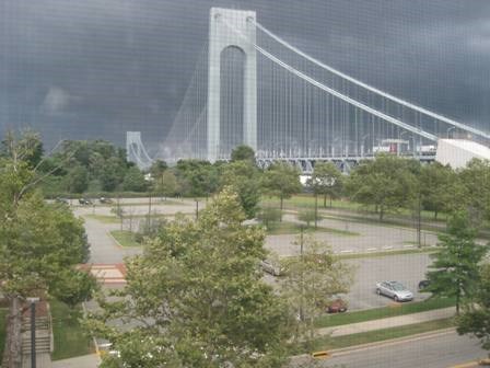A storm approaches Fort Wadsworth and the Verrazano Bridge.