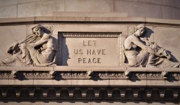 Let us Have Peace Epitaph carved on granite face of tomb