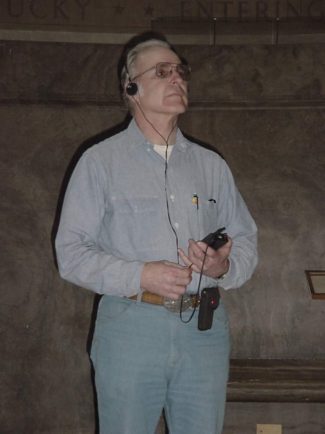 Visitor Listening to Audio Tour