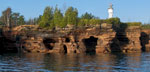 Devils Island light tower rises above the cliffs