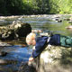 boy on the bank of Bluestone River