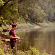 angler on riverbank