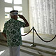 man salutes fallen Sailors and Marines of the USS Arizona