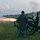 Volunteers fire a cannon