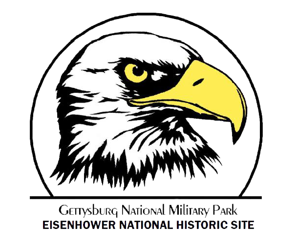 The logo of an eagle. The eagle is looking from left to right. Its head is covered with white feathers. Its eye and beak are yellow. Under it are the words Gettysburg National Military Park and Eisenhower National Historic Site.