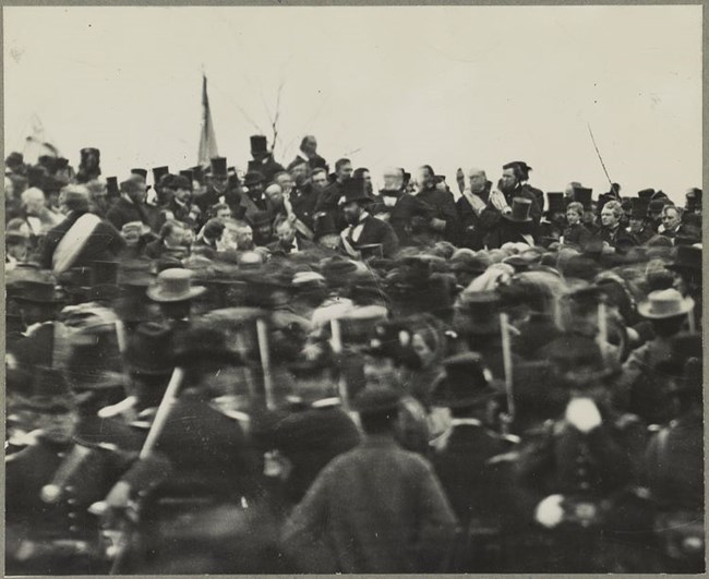 Lincoln at Gettysburg November 19, 1863 A large crowd gathers around a platform upon which is Abraham Lincoln and a host of other dignitaries in attendance for the dedication of the Gettysburg Soldiers' National Cemetery