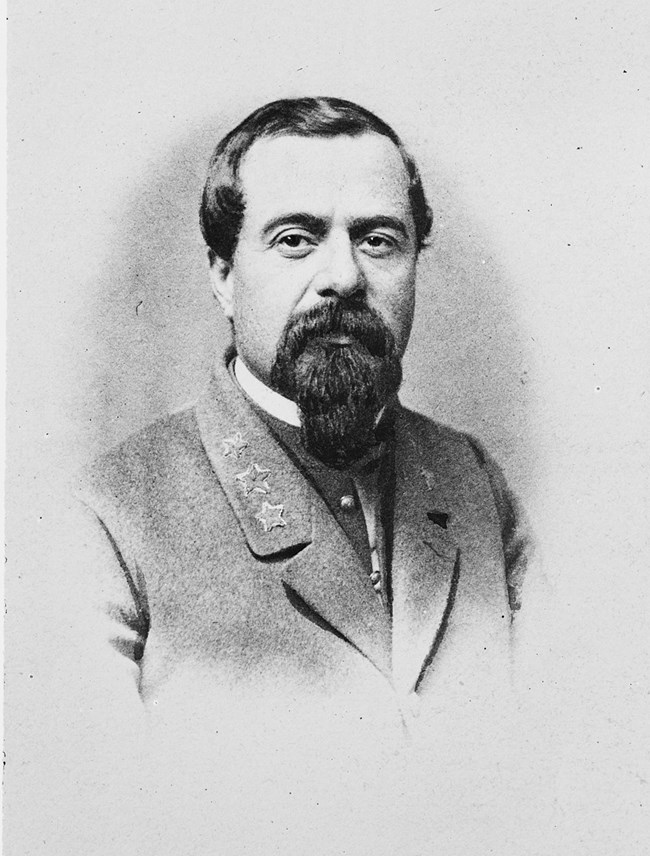 Black and White photot of a man in a grey military uniform