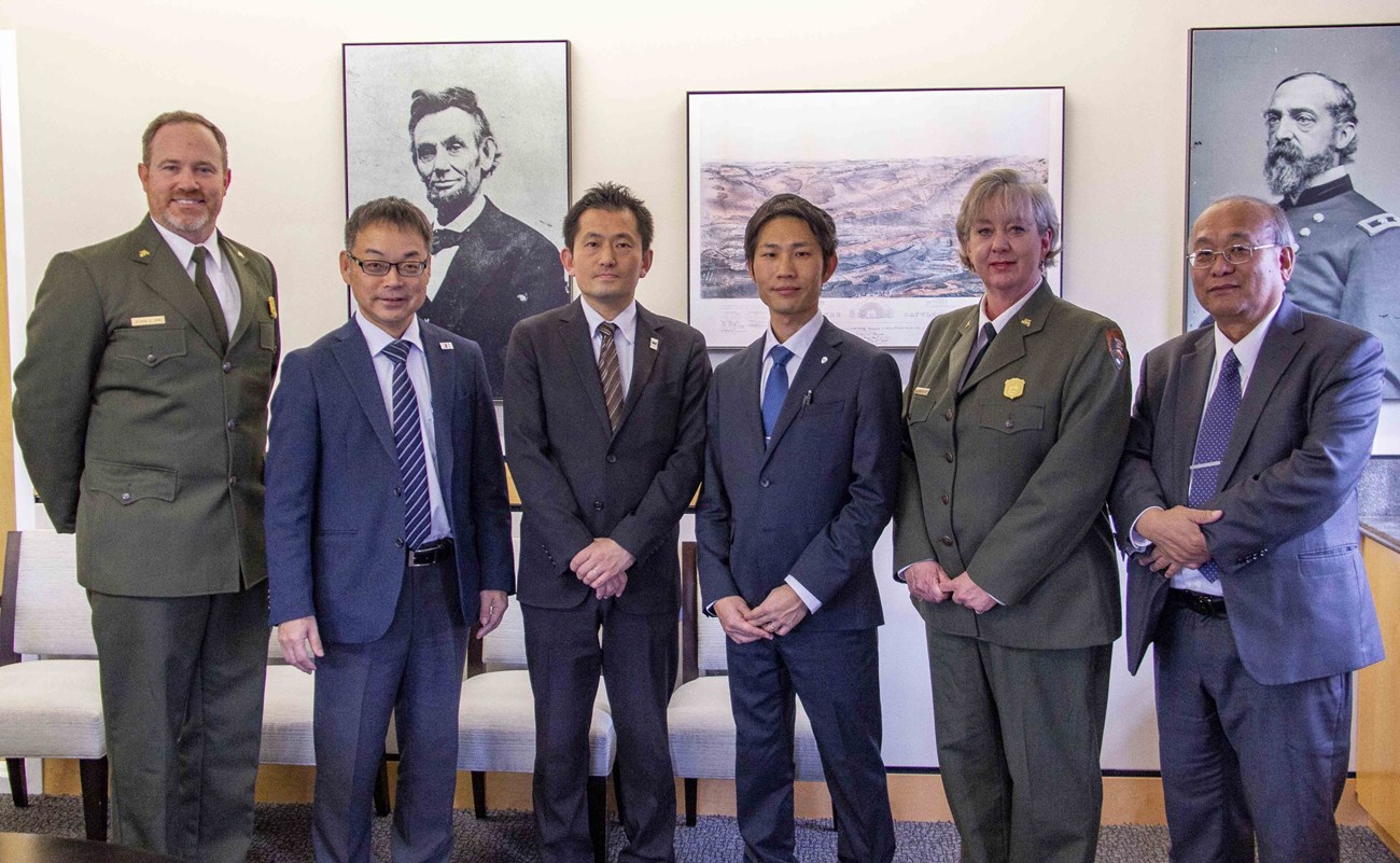 Sekigahara delegation standing beside Gettysburg National Military Park superintendent and deputy superintendent.