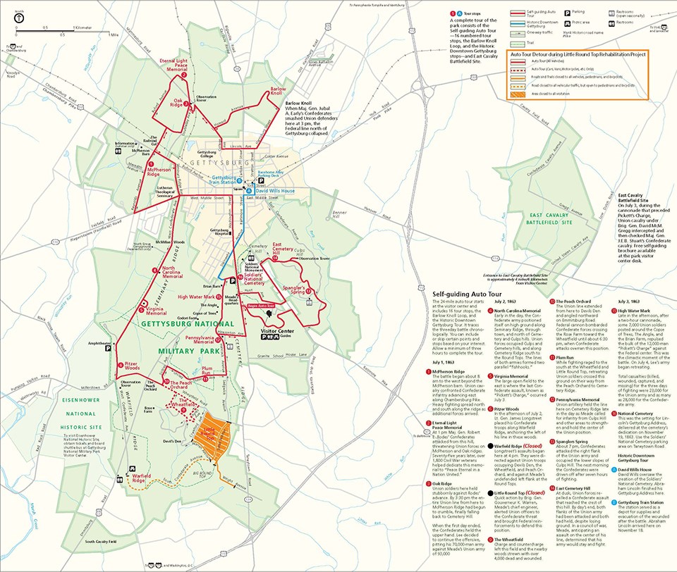 A color map showing a main auto tour route in red, a dashed blue line for a bus detour, and an orange dashed line for the automobile detour.