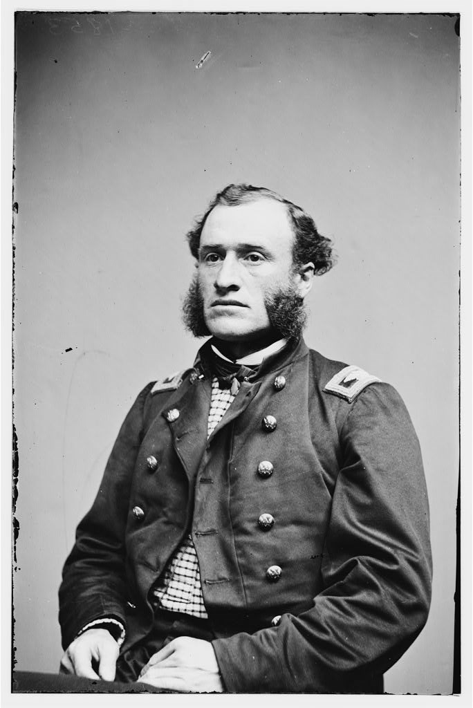 Colonel Henry Morrow sits for a photograph. He is wearing the uniform of a Union Civil War colonel.