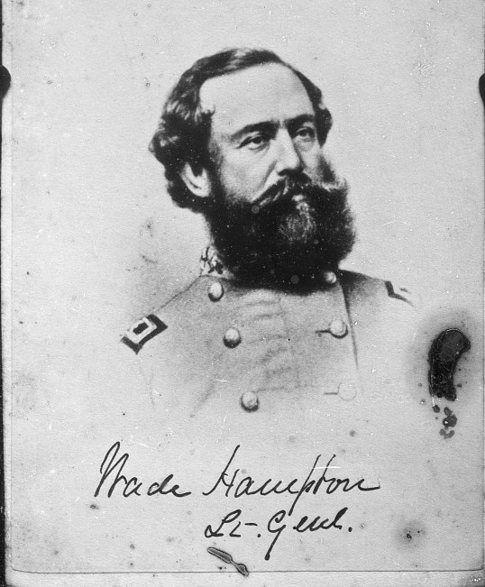 Bearded man in a gray military coat