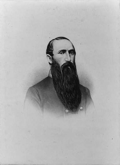 Bearded man in a gray military coat
