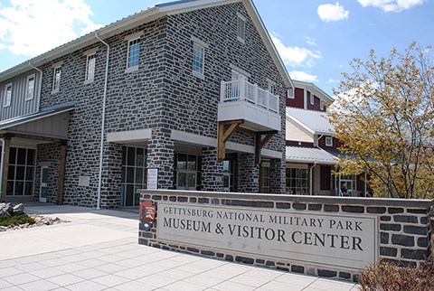 The Museum and Visitor Center as seen from the outside. The park sign is on the right.