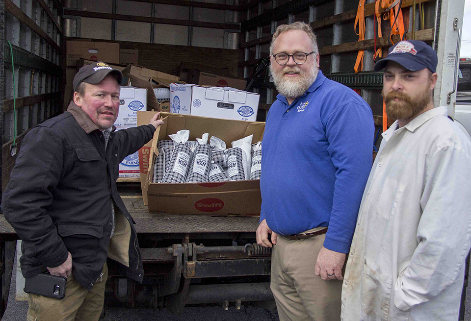 Employees at Butcher Block and a local food bank pose for a picture with the donated venison.