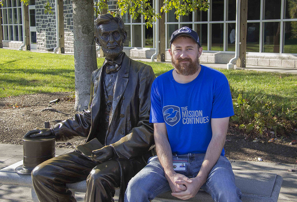 Tim Dolen, Veteran Outreach Coordinator, sits with the Abraham Lincoln statue. Tim Dolen, Veteran Outreach Coordinator, sits with the Abraham Lincoln statue.