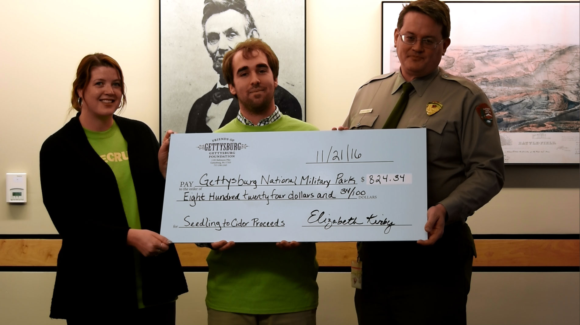 Gettysburg Foundation staff present a check to park superintendent