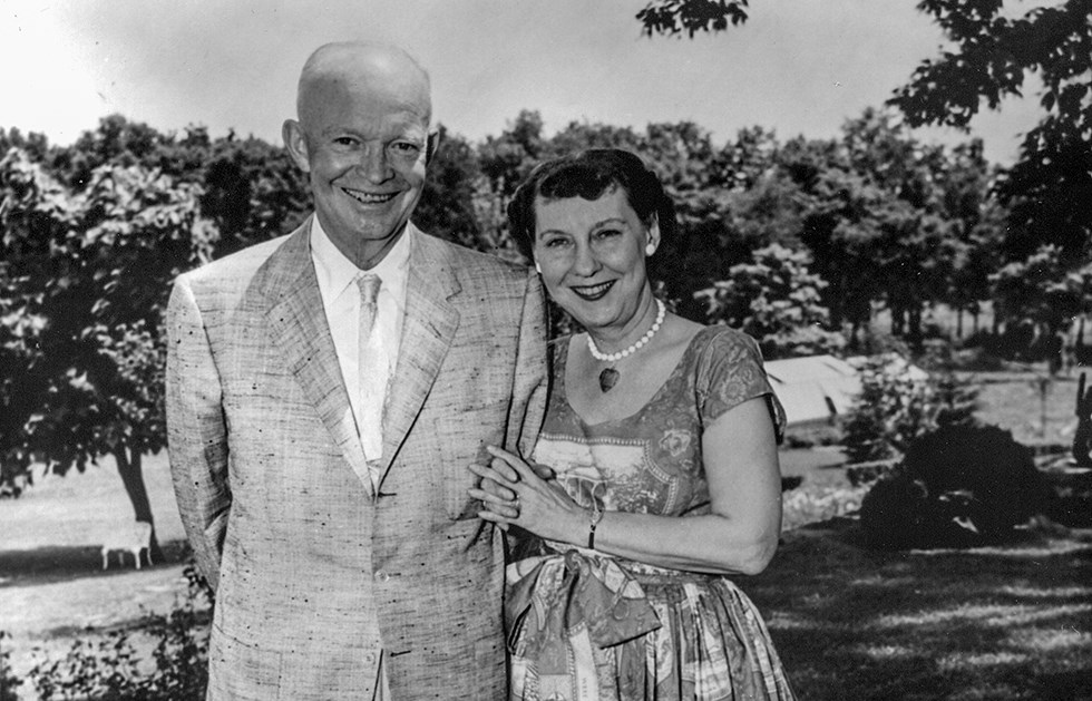 Dwight and Mamie Eisenhower stand arm in arm off the rear patio of their Gettysburg home. Dwight and Mamie Eisenhower stand arm in arm off the rear patio of their Gettysburg home.