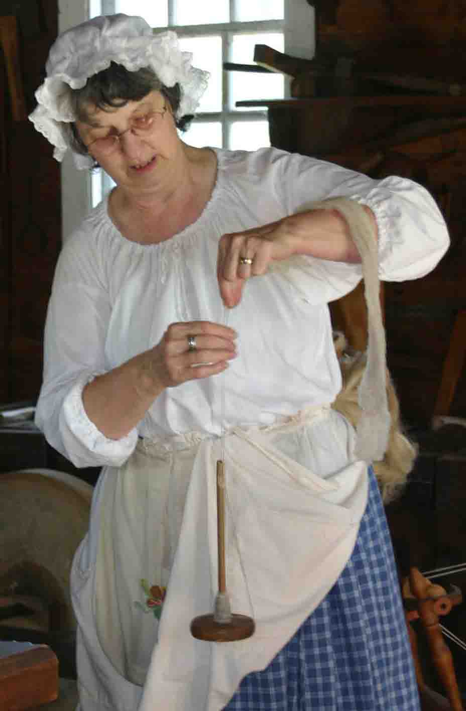 Volunteer demonstrating spinning during curriculum based education program