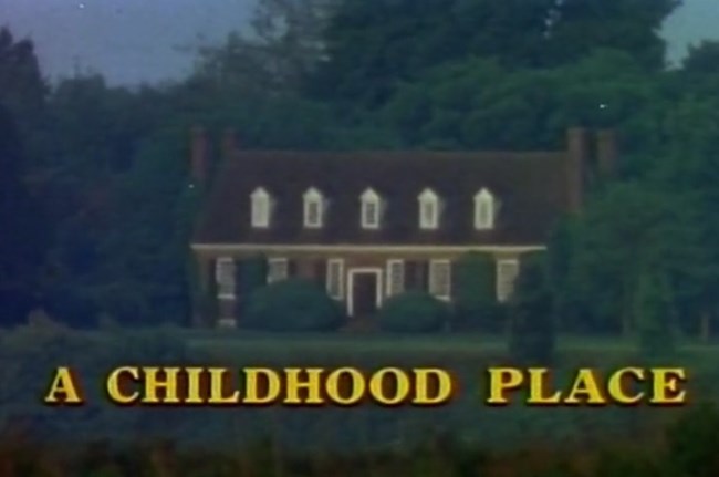 old picture of the memorial house with text "A Childhood Place" at the bottom