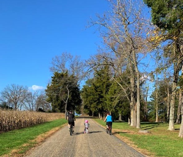 Bicyclists on road to Potomac River beach