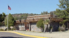 Photo of Visitor Center with flag.