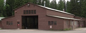 Large barn-like structure with open garage door