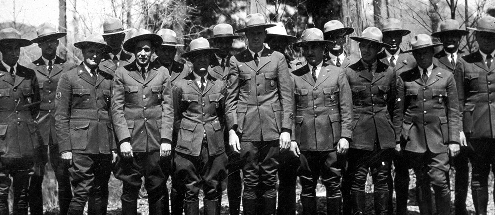 historic image of uniformed rangers in flat hats and jodhpurs