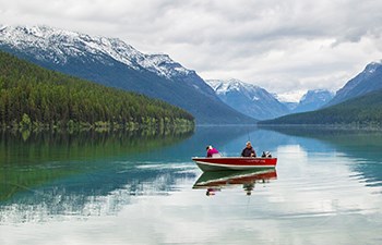 Overcast day with motor boat on mountain lake