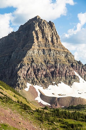 mountain with steep cliff face