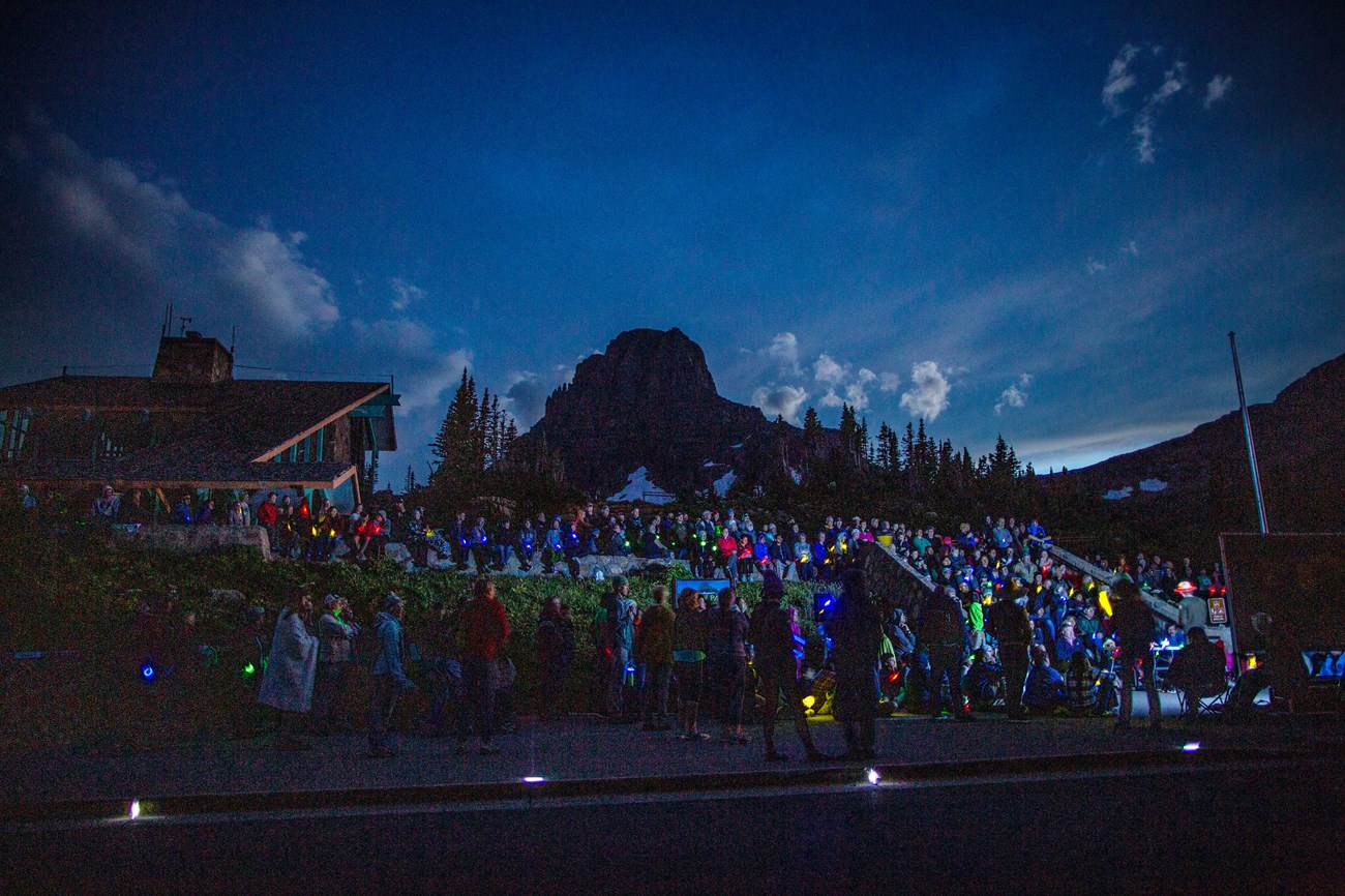Visitors gather to watch a program introduction