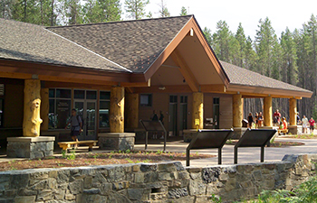 building with peaked roof and wood columns