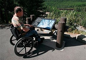 man with wheelchair at wayside exhibit