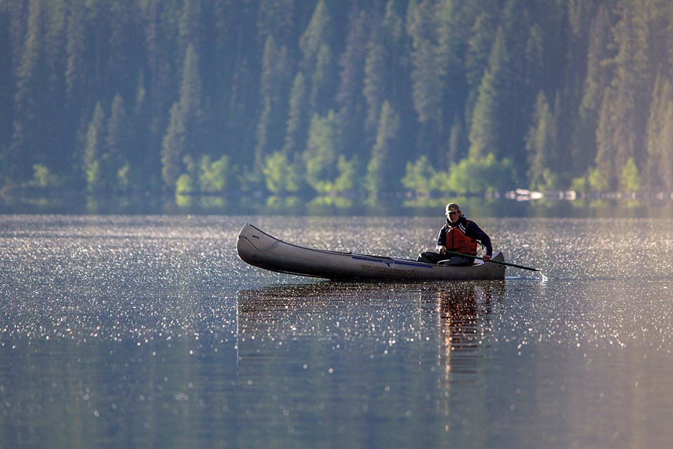 canoe on lake in Glacier National Park