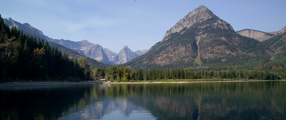 ranger station on lakeshore surrounded by peaks ranger station on lakeshore surrounded by peaks