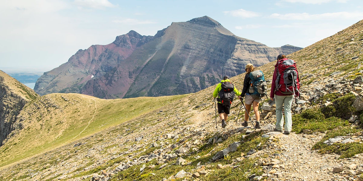 Hikers along a high alpine trail Hikers along a high alpine trail