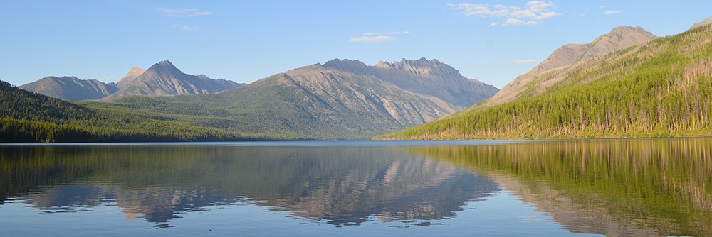 sun on mountain landscape and lake