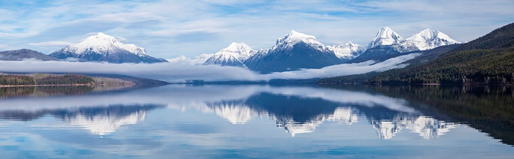Lake with mountains and low fog