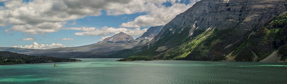 mountain lake with wind rippling water surface mountain lake with wind rippling water surface
