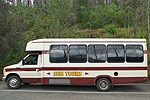 Bus with large windows and Sun Tours written on side