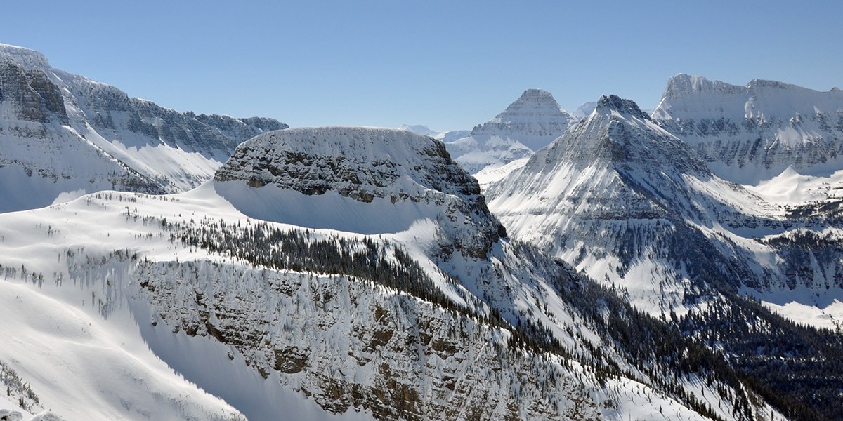 view of Haystack Butte and the mountains behind in the middle of winter.