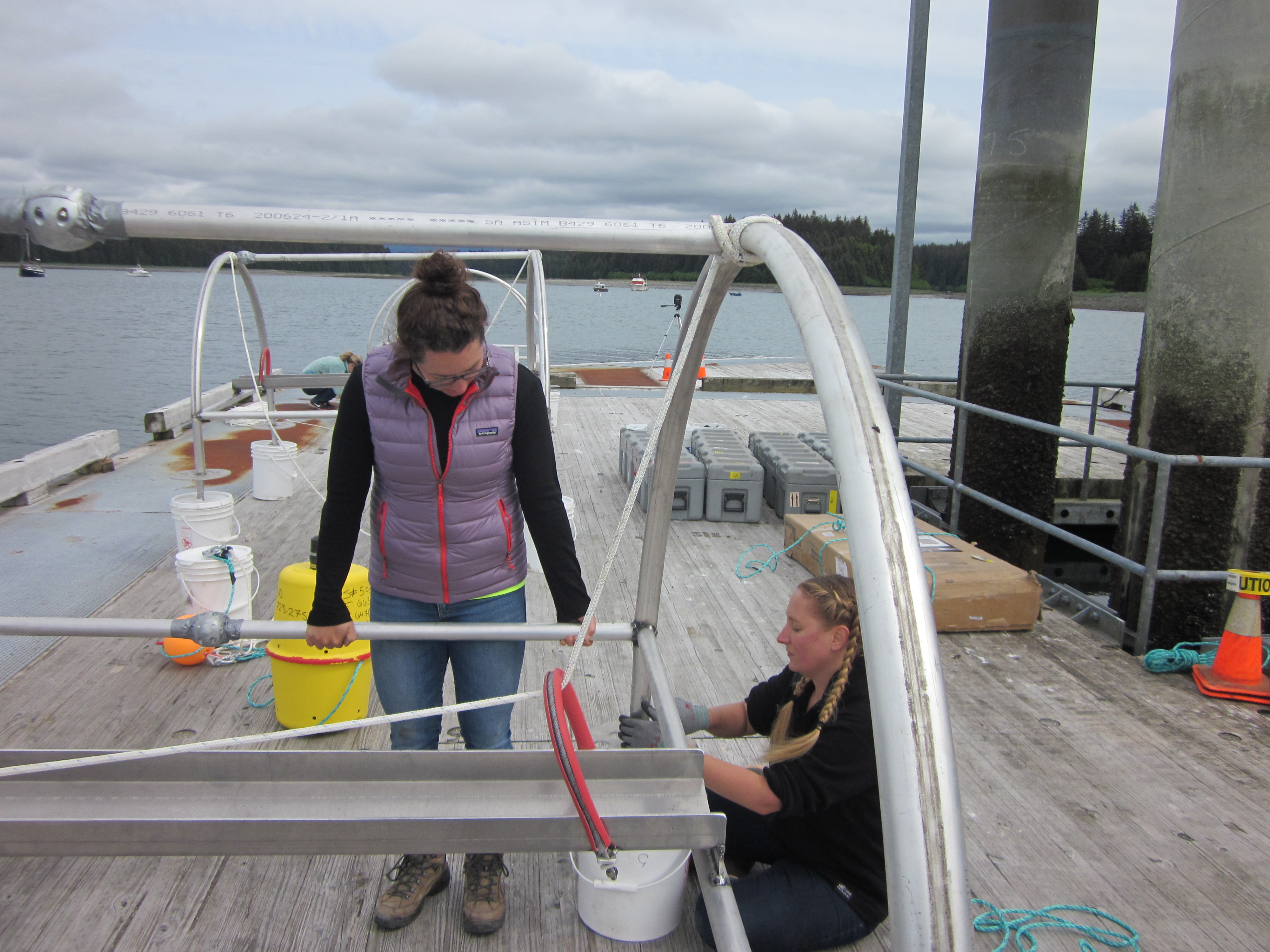 Two women work on the hydrophones