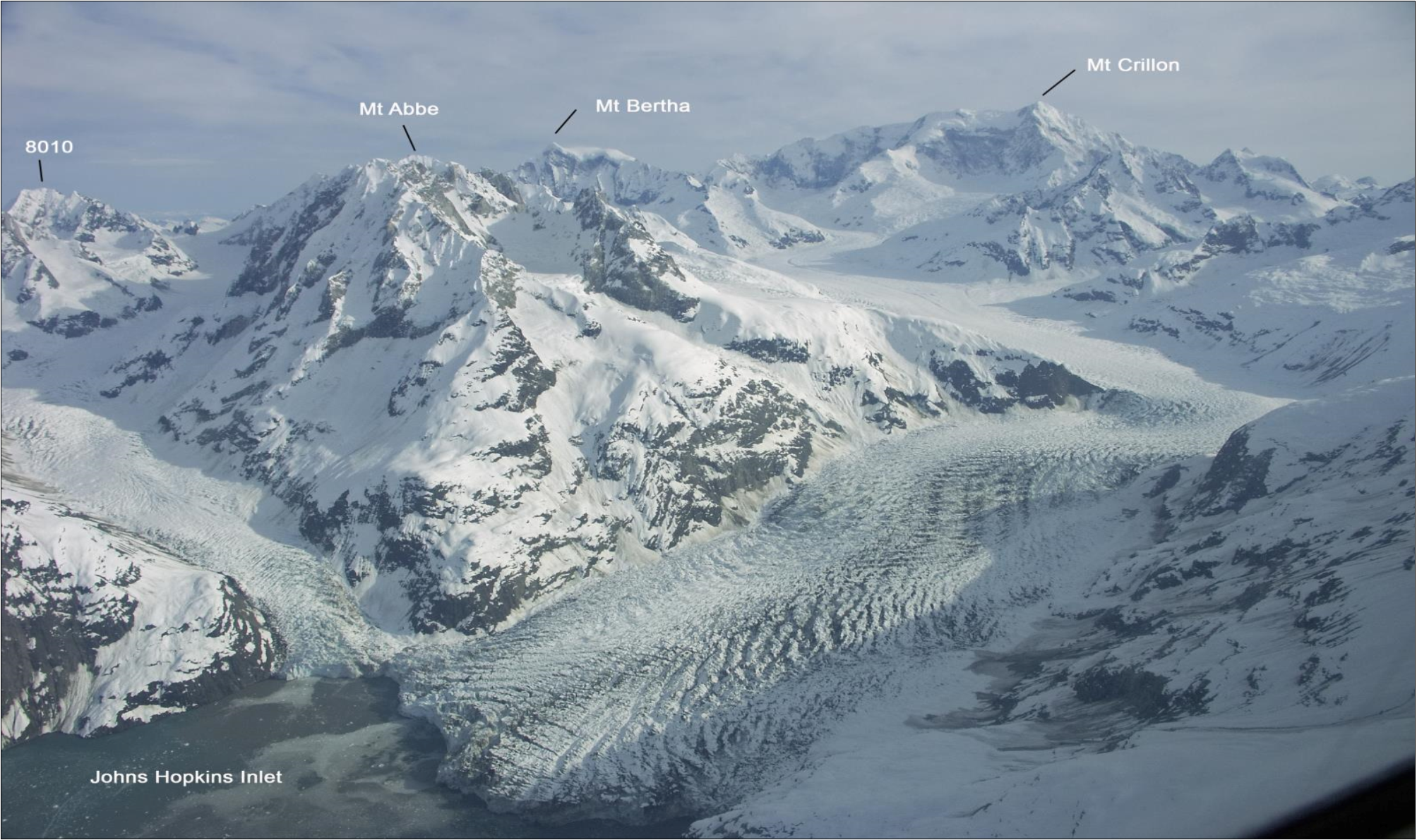 Four distinct mountain peaks labeled with a glacier in the foreground