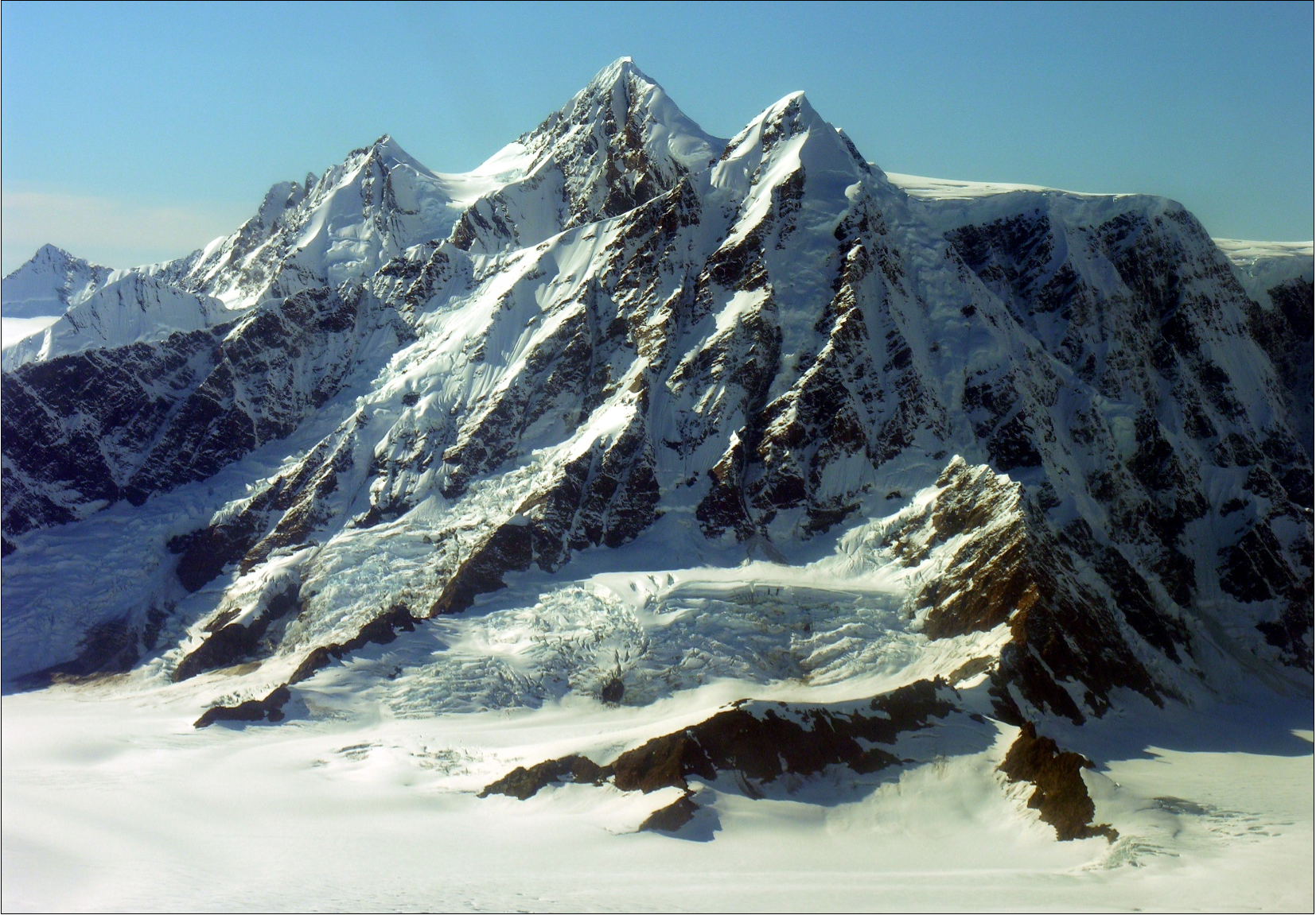 Mountain peaks with snow and exposed rock faces