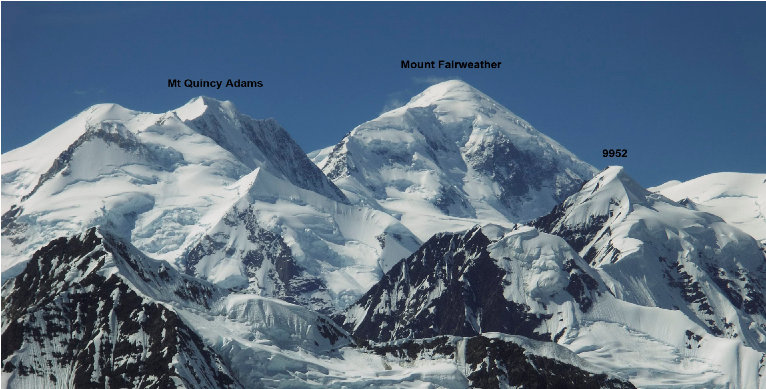 Two snow-capped mountains side by side